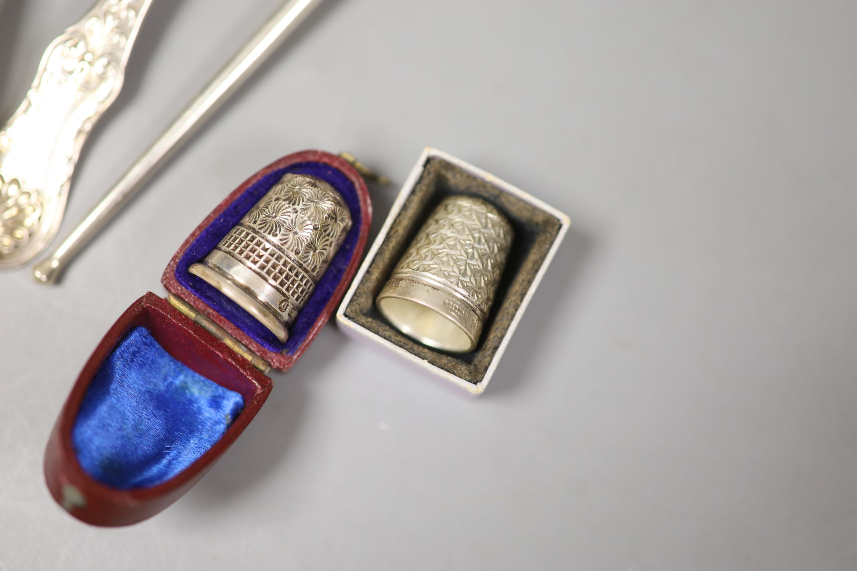 A pair of William IV Scottish silver Queen's pattern sauce ladles, Glasgow, 1930, a Georgian silver sifter spoon, one other spoon and two thimbles, including silver Charles Horner.